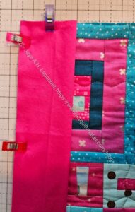 Facing end clipped to quilt
