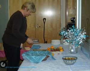 Kathleen preparing the table