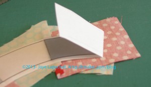 Fold back pattern and prepare to trim seam allowance