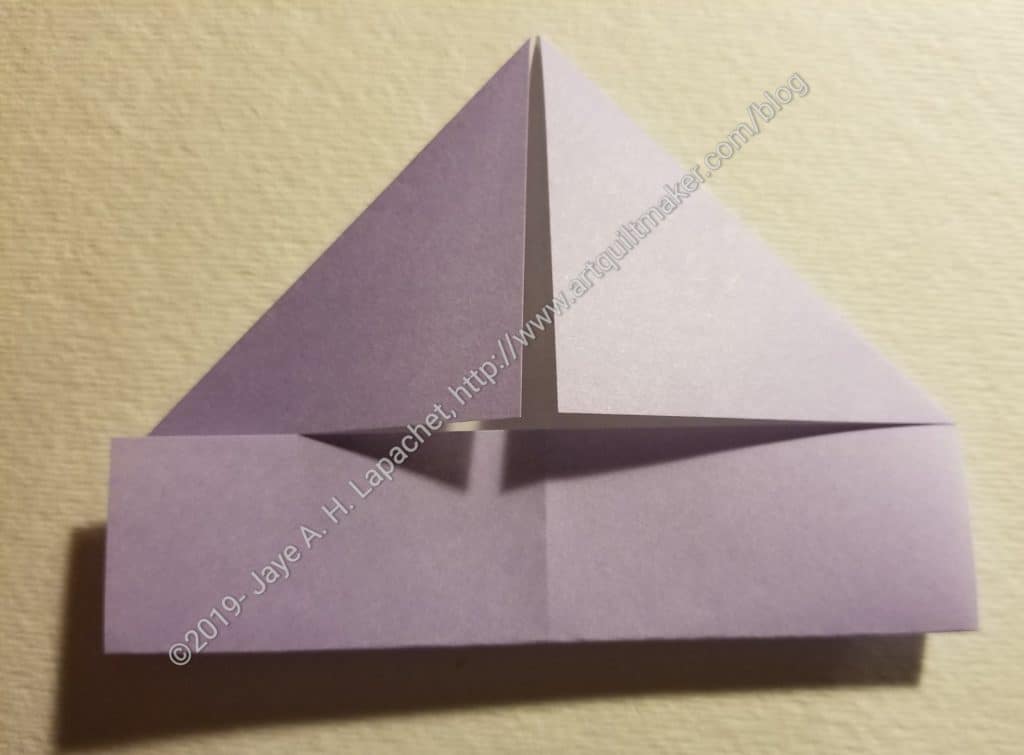 Fold bottom up to meet the two corners