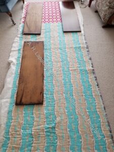 Laying out fabric for table leaf bags