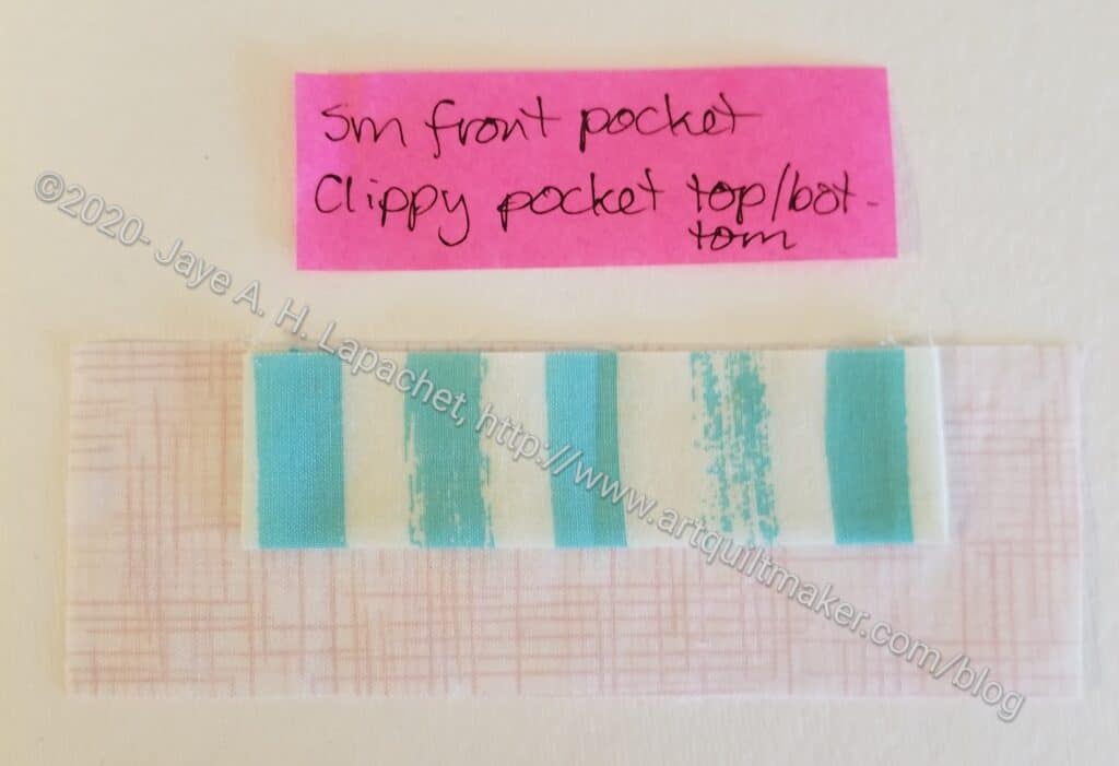How to attach tabs to 'between' fabrics