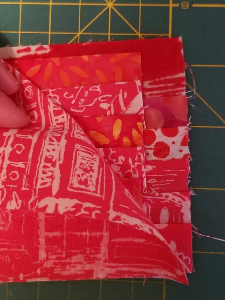 Layer your ‘flap ladder’ RST with piece D and sew along the short sides